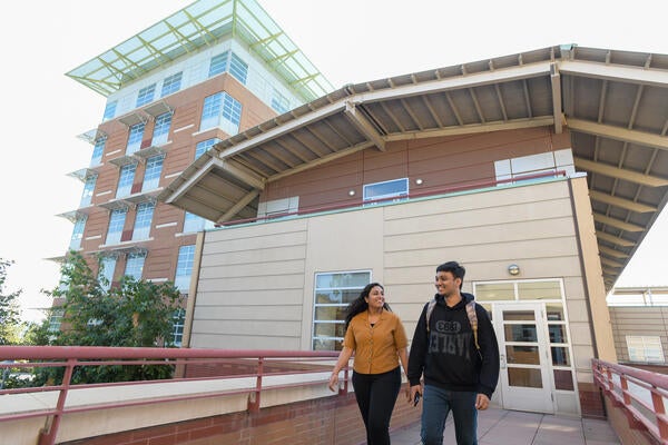 Students on the CHASS building upper patio